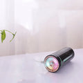 Black portable USB rechargeable humidifier with colourful LED lights on car cup holder
