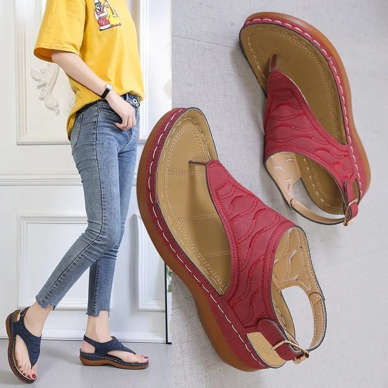 Women's black casual wedge heel sandals with an adjustable back strap buckle.