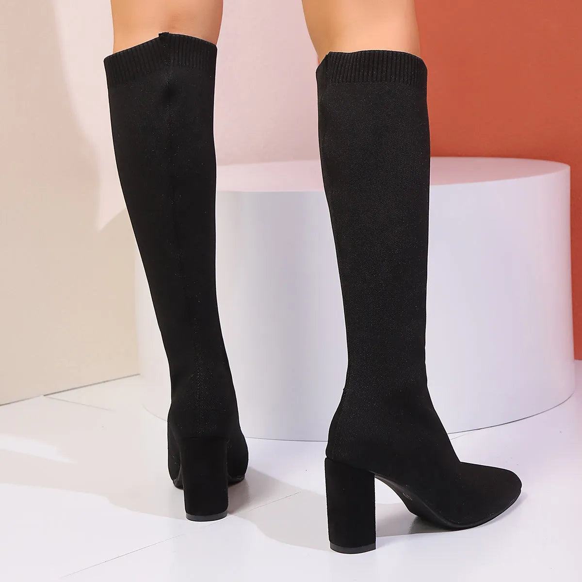 Black high heel fashion boots for women with fabric upper and high shaft