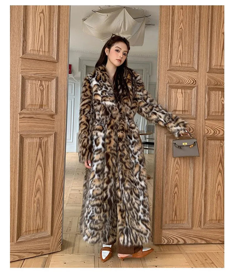 A long faux fur coat with a fox fur-style collar, shown in a street fashion context.