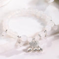 Close-up of electroplated opal cat's eye beaded bracelet for women with diamond-shaped charm