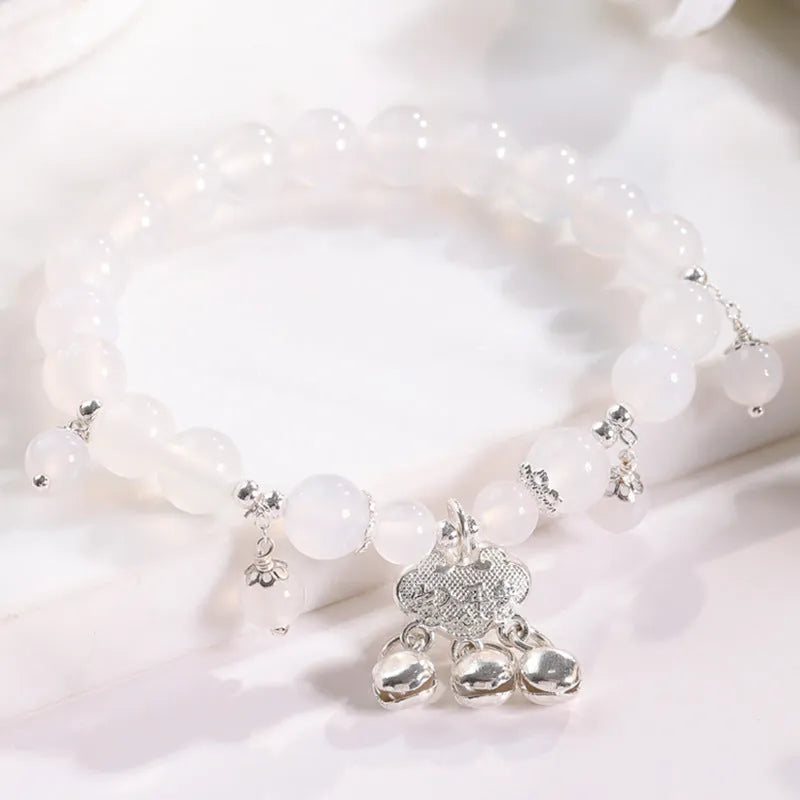 Close-up of electroplated opal cat's eye beaded bracelet for women with diamond-shaped charm