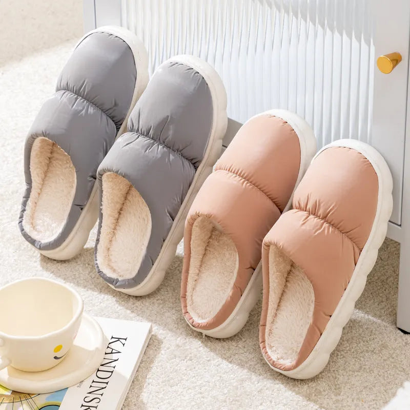 Blue down cotton winter slippers with thick rubber sole and plush lining for indoor use.