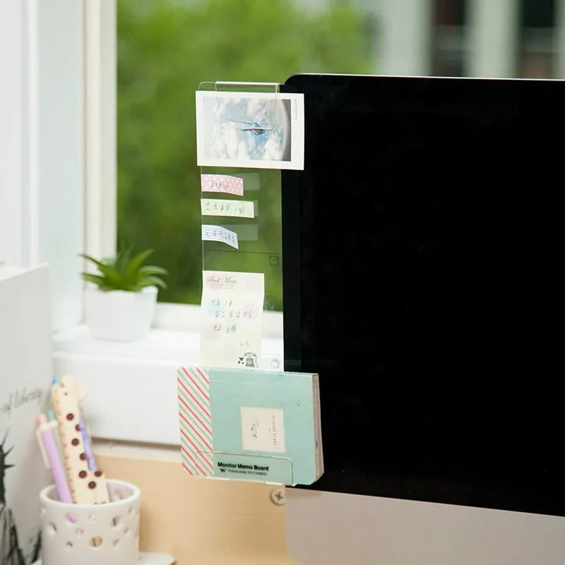 Clear acrylic monitor message memo board with suction mount, showing a post-it note attached, in a modern simple style