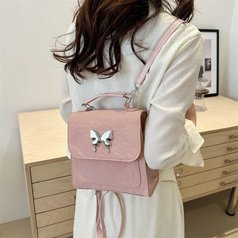 Women's PU leather backpack in multiple colours with bow detailing and hand-carrying option