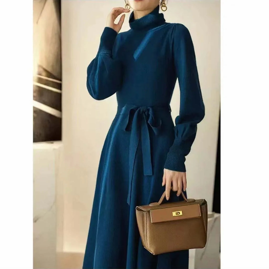 Rose red turtleneck knit dress with long sleeves, elastic waist, and a loose, flowing mid-length skirt.