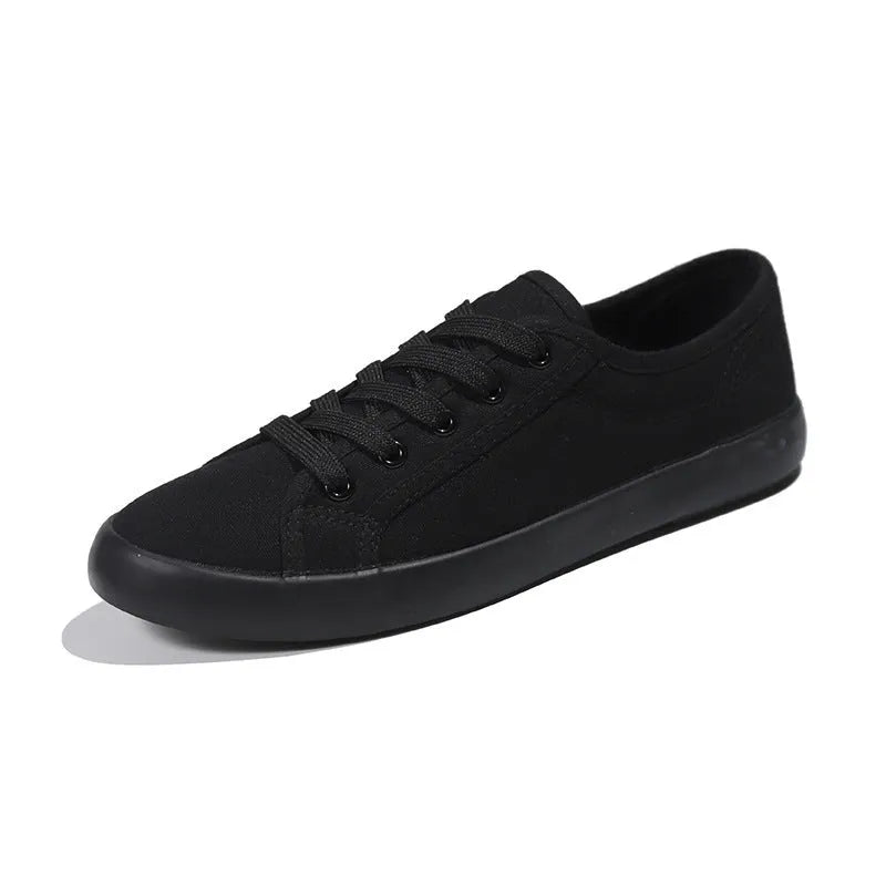 All black Korean-style women's canvas flat shoes with lace-up front and rubber sole