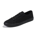 All black Korean-style women's canvas flat shoes with lace-up front and rubber sole