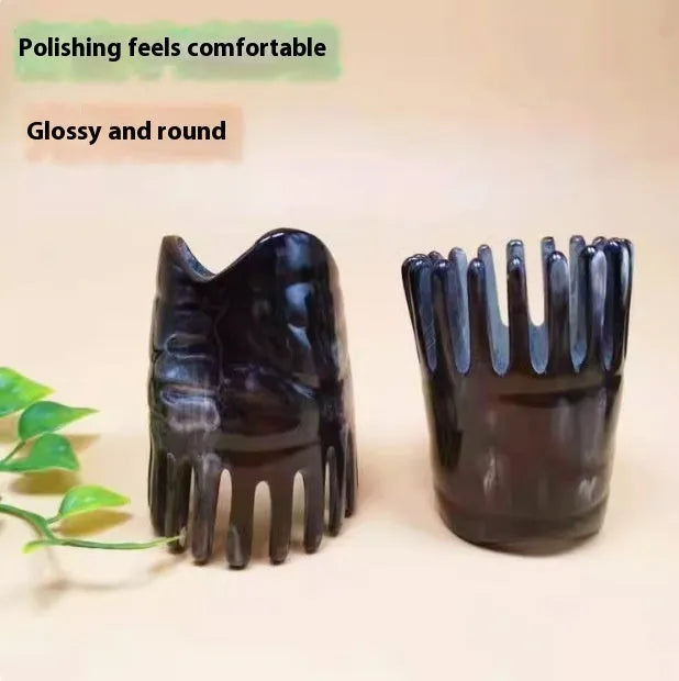 Black buffalo horn comb with wide teeth and pointed tip for scalp massage