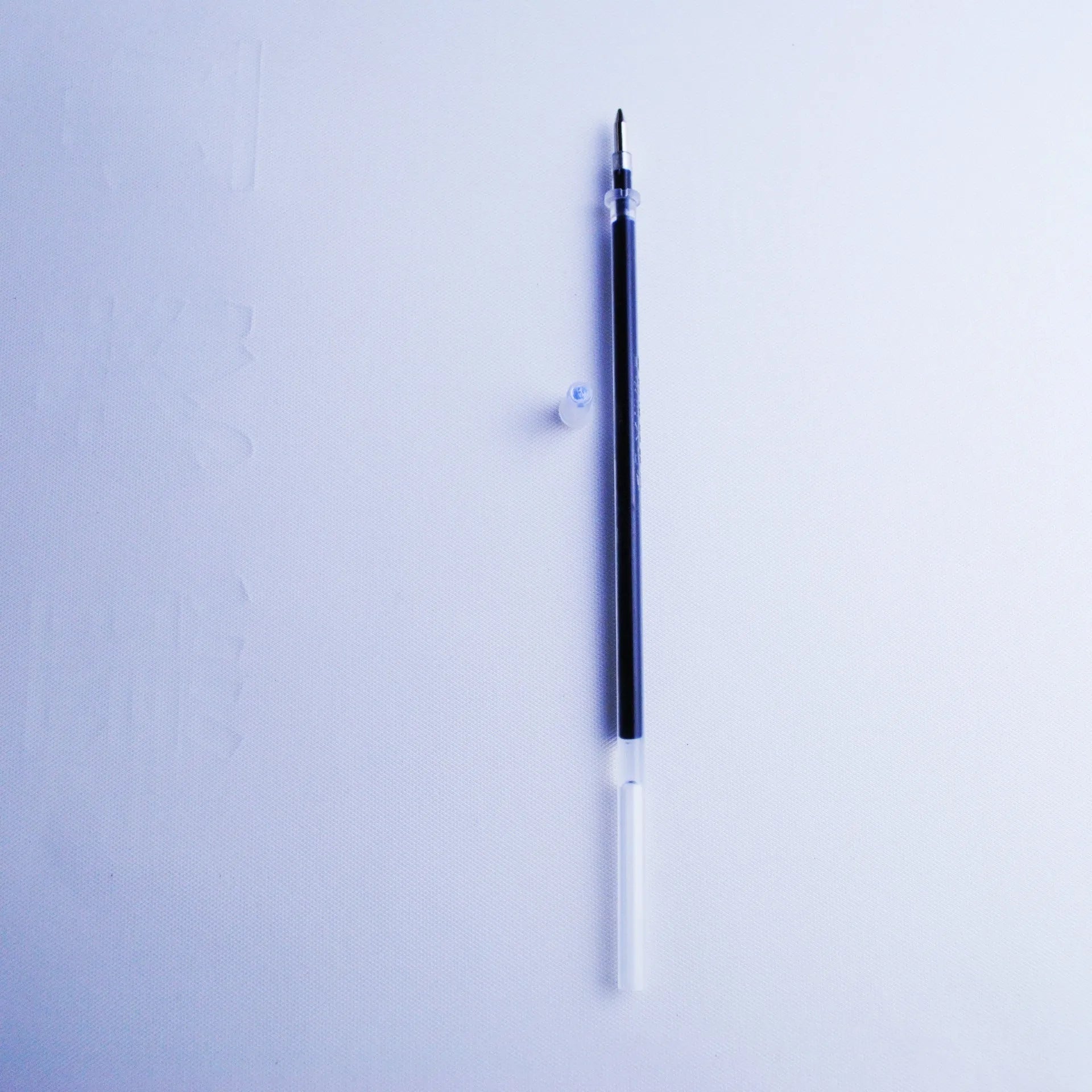 Portable automatic fading pen core set with blue refills, pen body, and holder