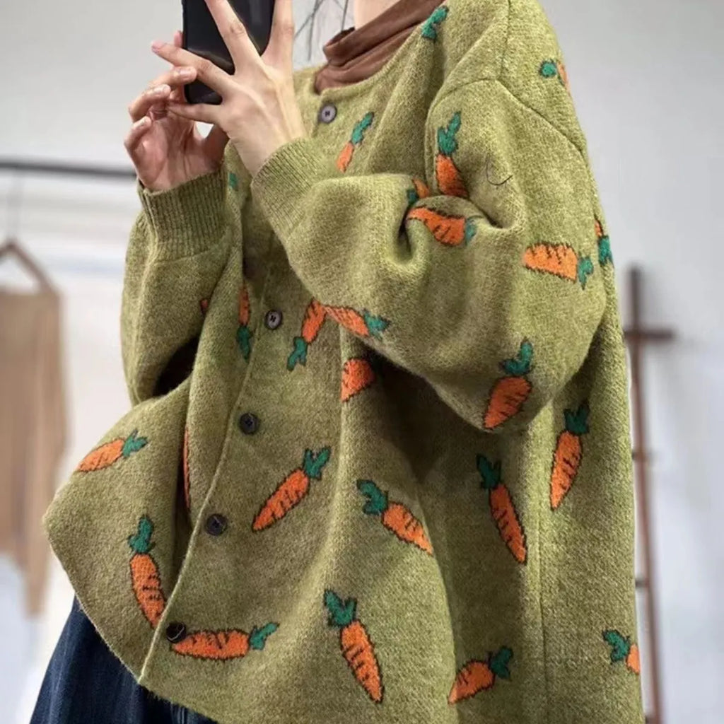 Loose grey cardigan with artistic colour-block printing, round neck, and regular sleeves.
