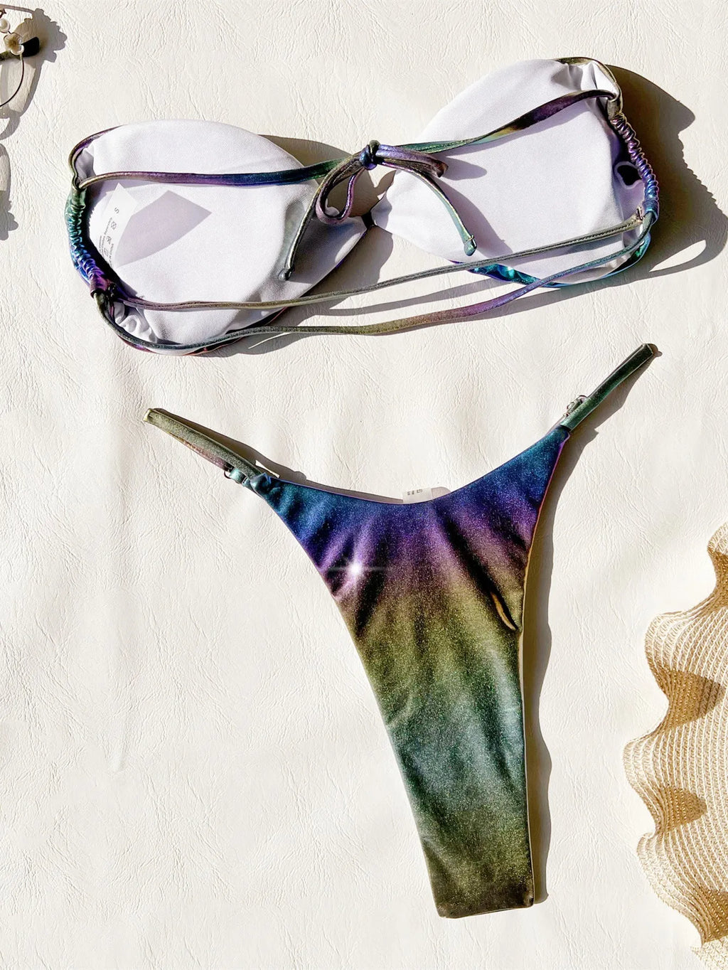 Women's gradient purple bikini swimsuit on a mannequin, showing the colour transition.