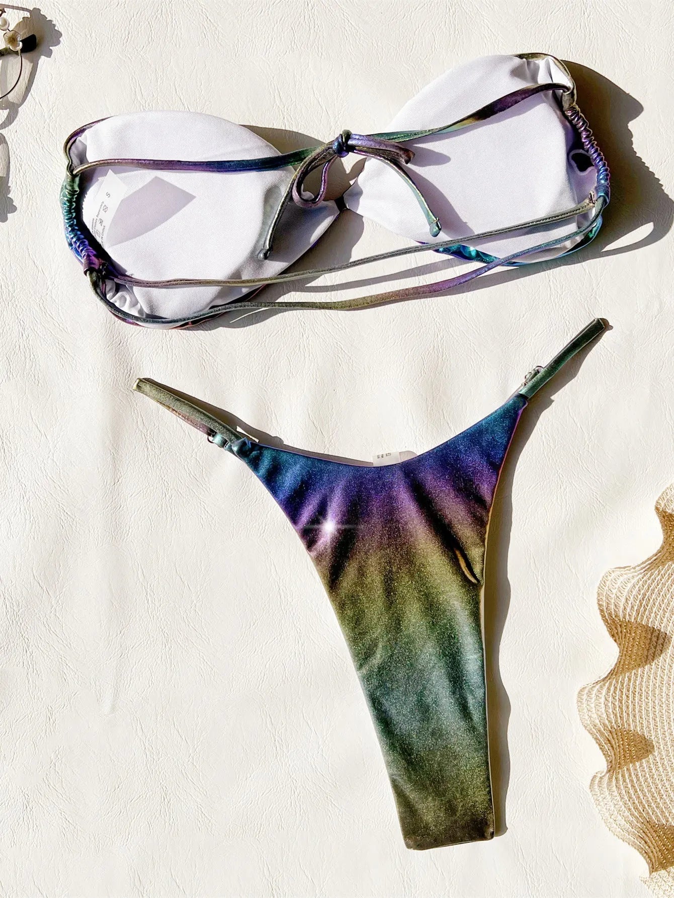 Women's gradient purple bikini swimsuit on a mannequin, showing the colour transition.