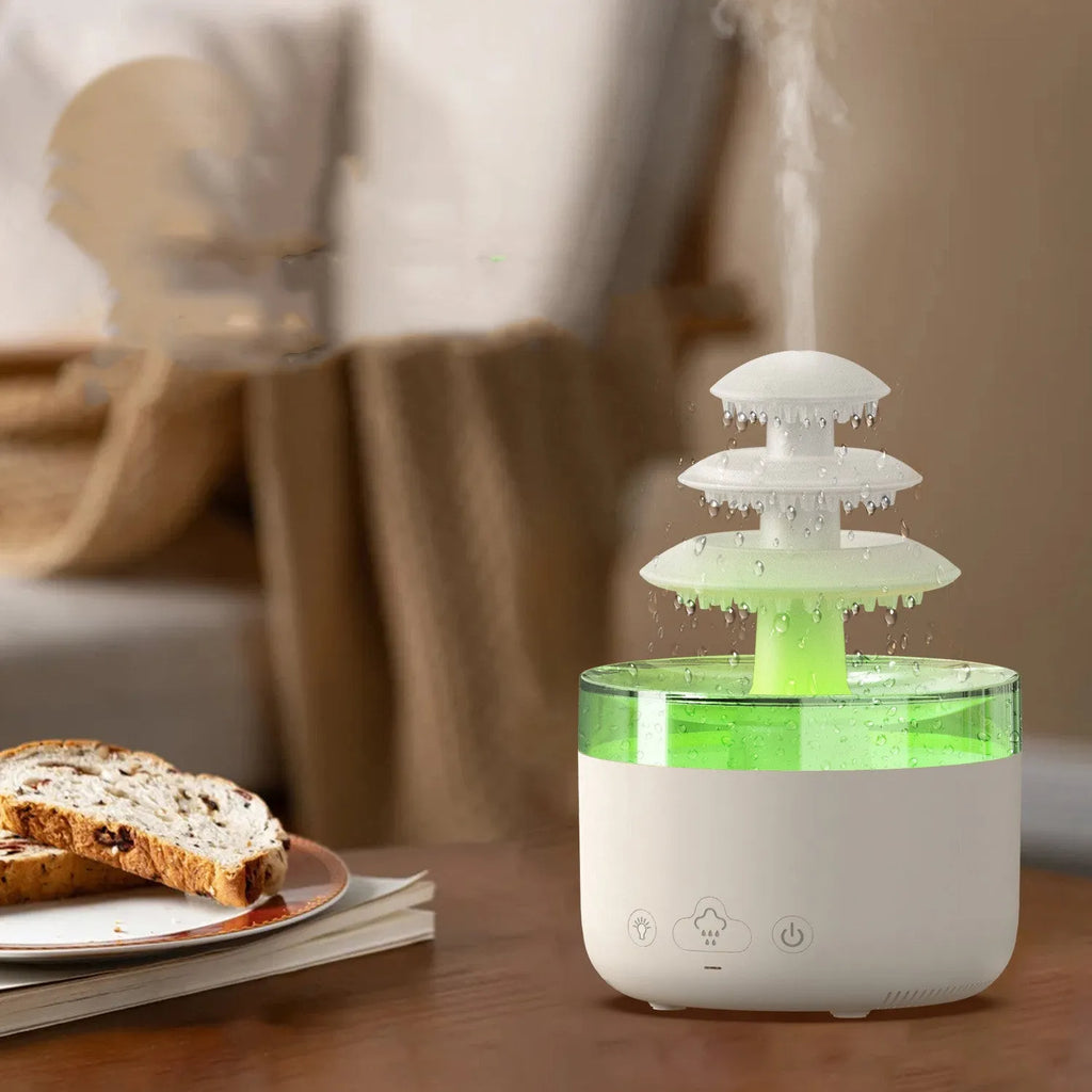 White Cloud Rain air humidifier and essential oil diffuser with colourful LED light on a table.