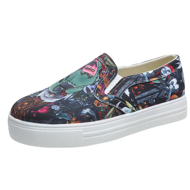 Women's low-top canvas trainers in multiple colours with flat rubber sole.