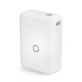 White D110 compact thermal label printer on desk with label paper and USB cable