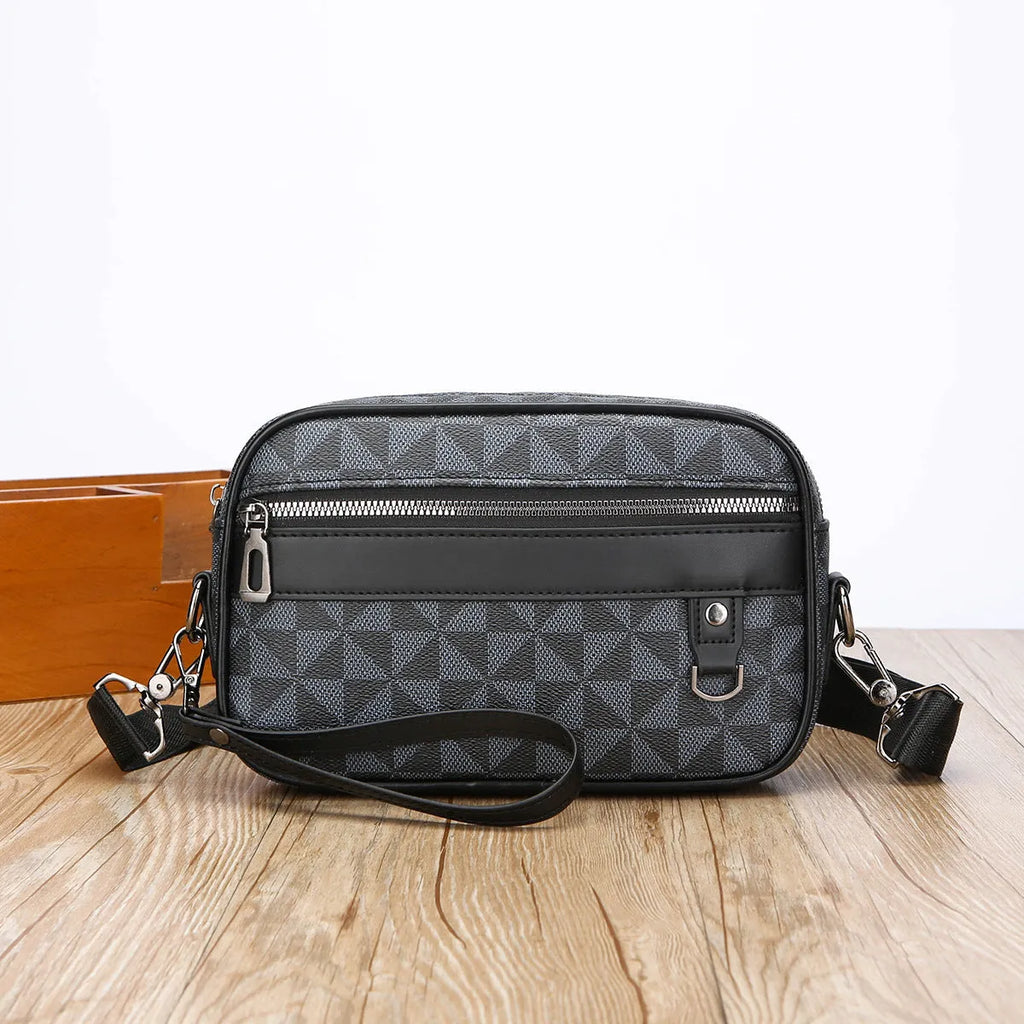 Men's black PU leather messenger bag with geometric pattern lining and shoulder strap
