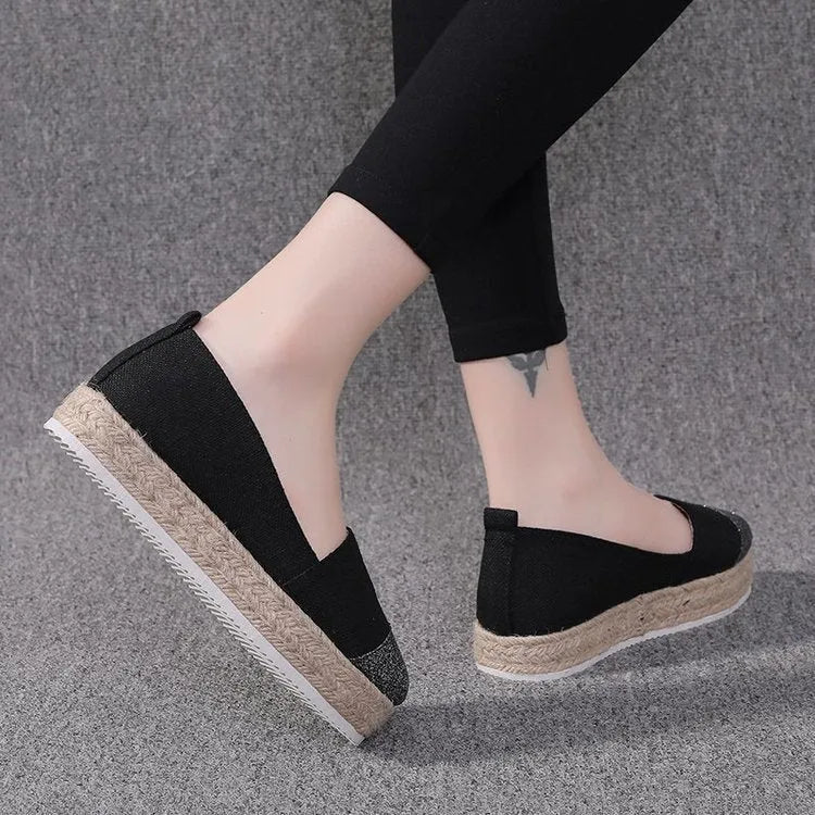 Plus size canvas flats in breathable cloth with round toe design and slip-on construction