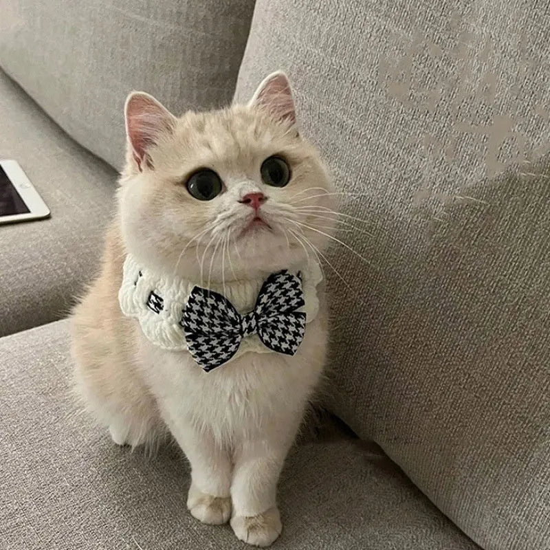 Red houndstooth wool knitted dog collar laid flat showing its pattern and length.
