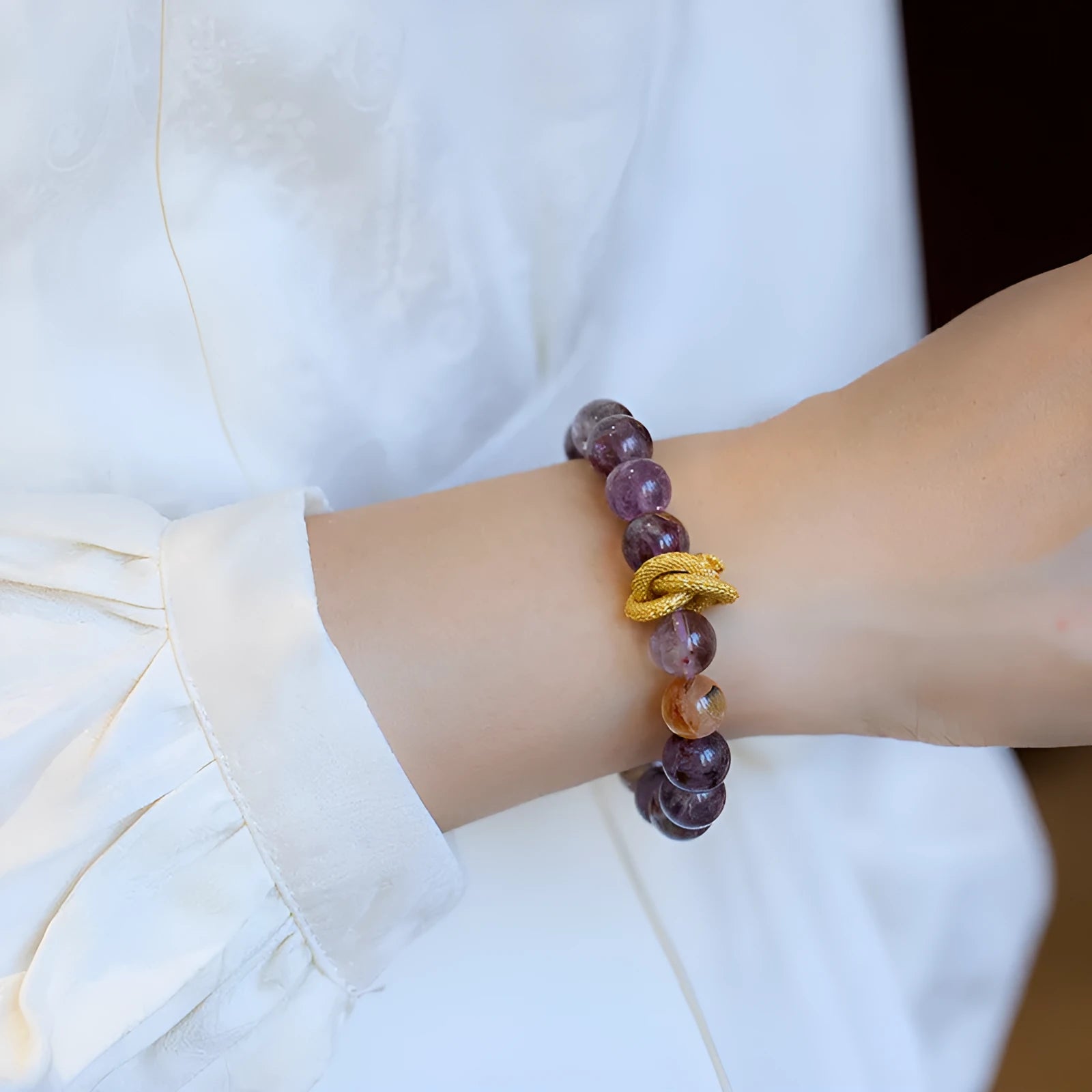 Purple cornucopia crystal bracelet with 10mm animal zodiac beads on wrist
