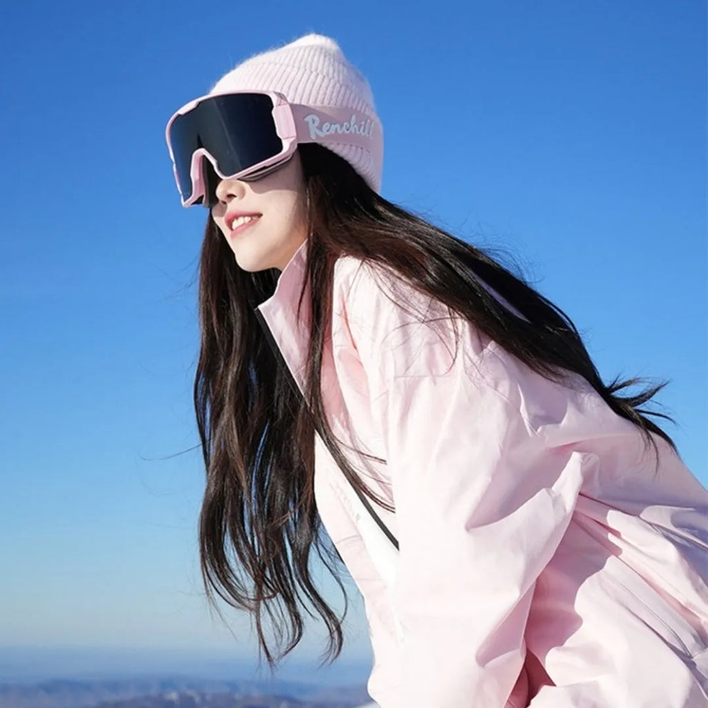 Pink and black waterproof cotton blend winter ski suit jacket and trousers set on hanger
