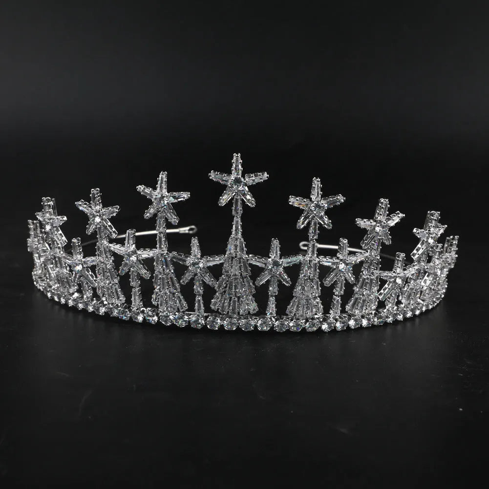 Copper bridal crown with zircon accents in gold finish on a stand
