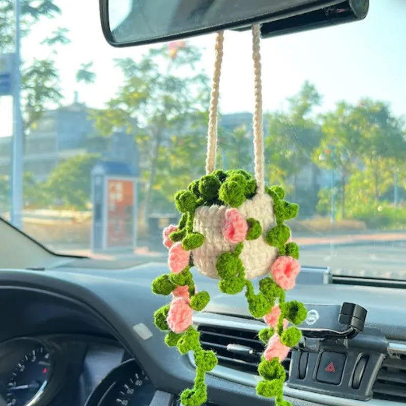 Green and white knitted wool car plant decoration with basin base and hanging rope