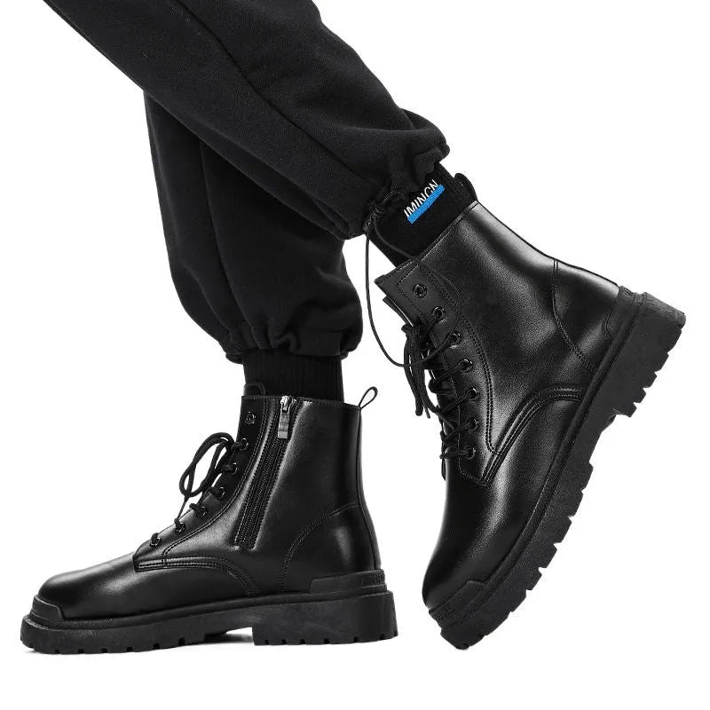 Men's black mid-top waterproof boots with a rubber sole on a grey background.