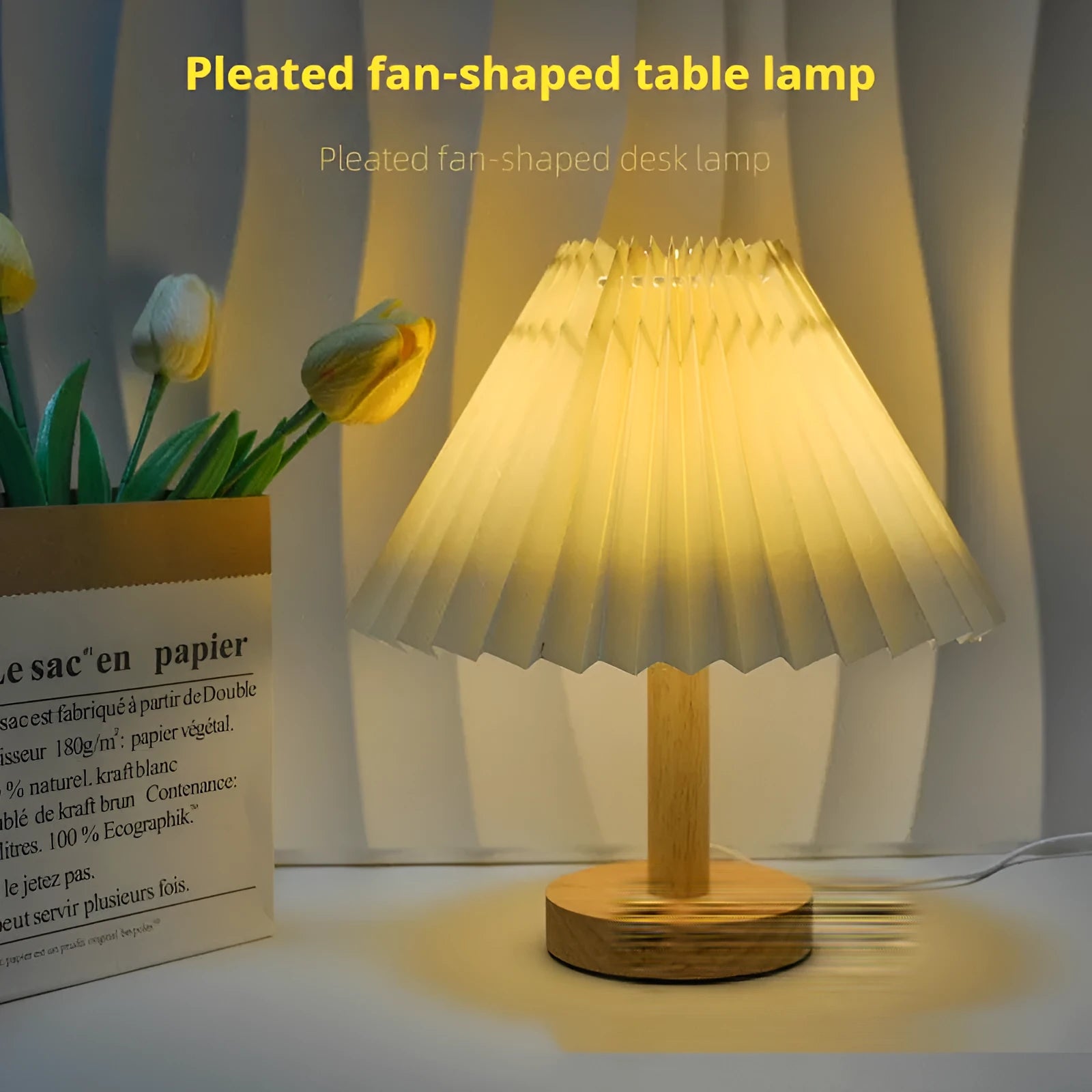 Vintage pleated umbrella-shaped USB bedside lamp with remote control on a wooden table.