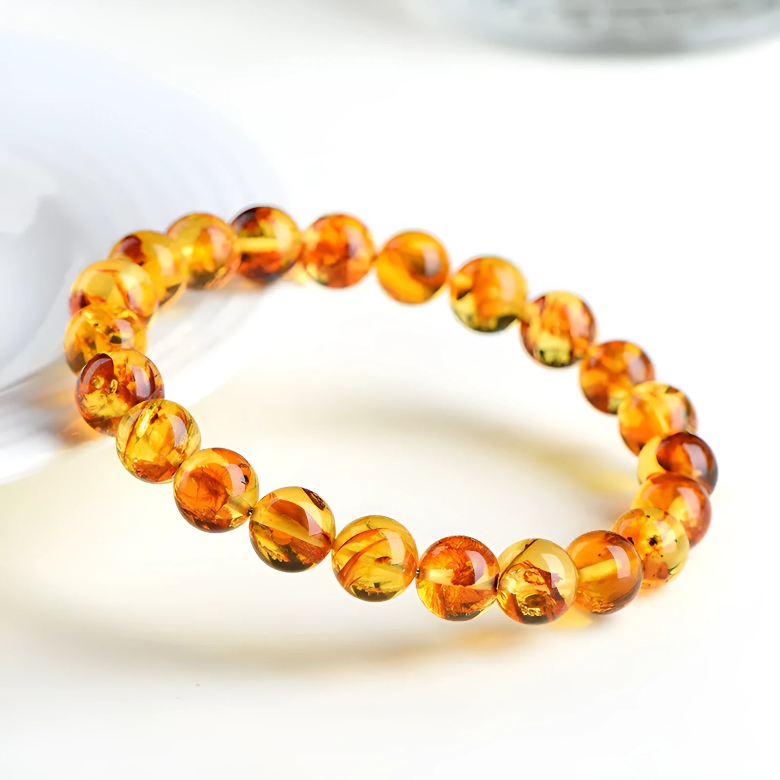 Natural yellow piebald amber bracelet with geometric polished beads.