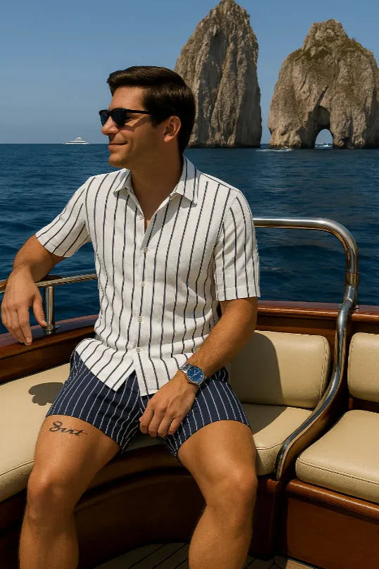 Man wearing a light mature casual style beach shirt and shorts set made from elastic fabric.