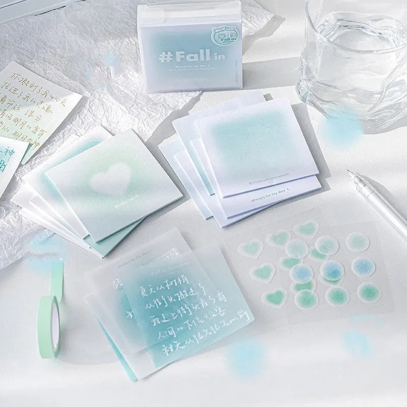 Carton of square sticky notes in a choice of blush, green, purple, or blue, showing 70mm x 70mm size