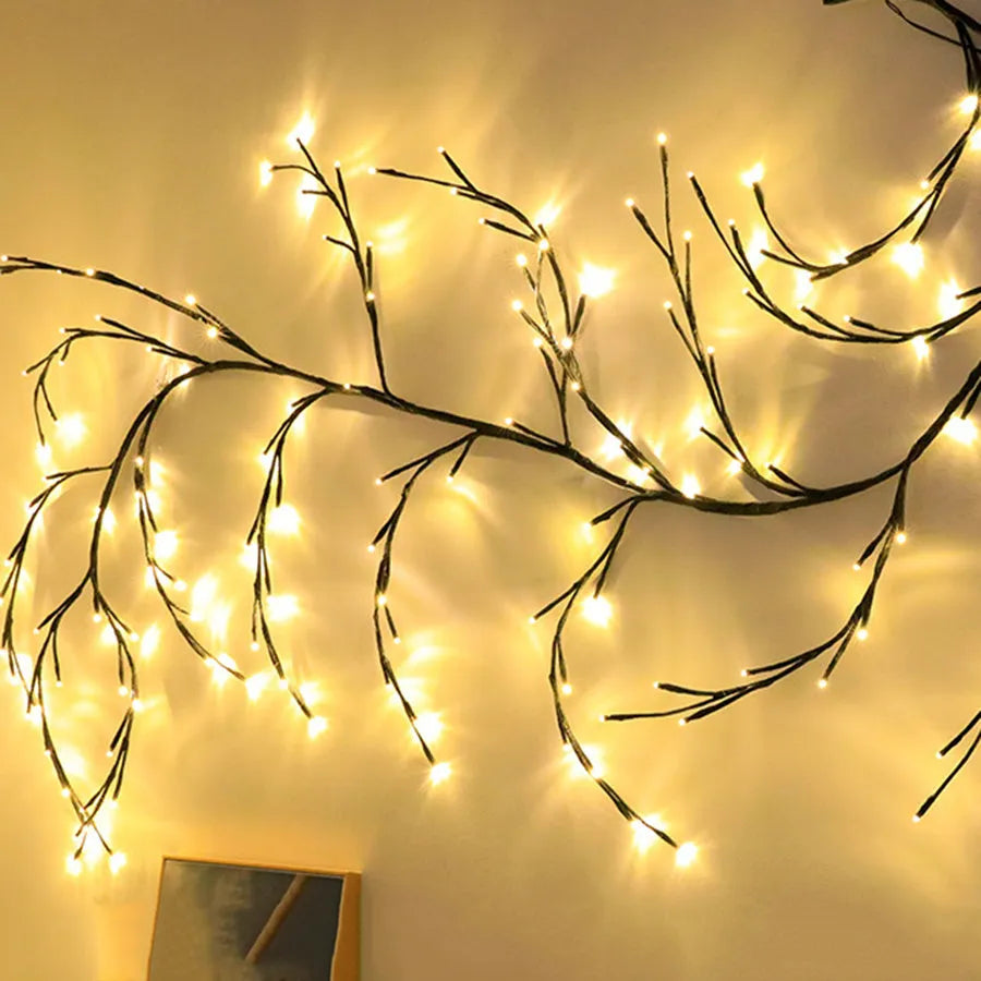 Flexible LED willow vine garland with warm white lights shaped into decorative curve