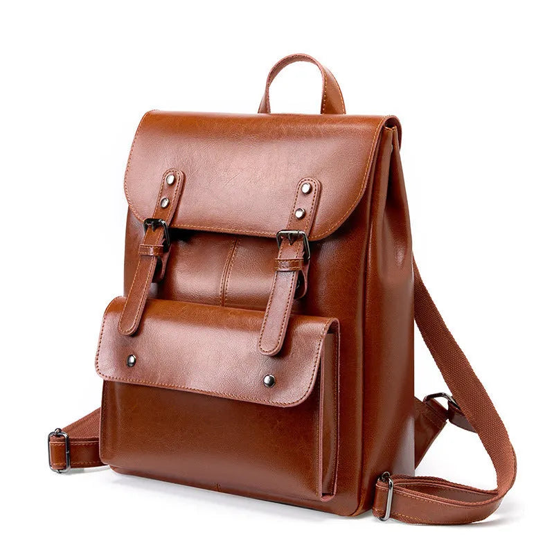 Black genuine cowhide leather computer backpack for women with hard construction.