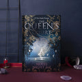 Blue and purple luminous hardcover A5 notebooks open to show full-colour illustrated pages