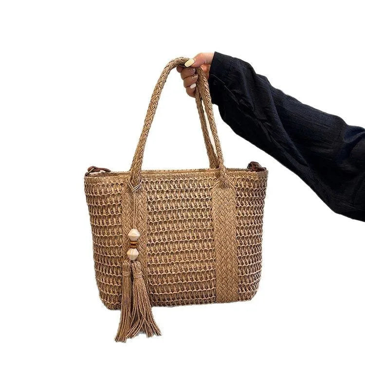 Women's straw woven crossbody shoulder bag showing diagonal weave pattern in milky white colour