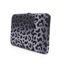 Leopard print laptop sleeve protecting 13-inch to 16-inch computers with waterproof polyester construction
