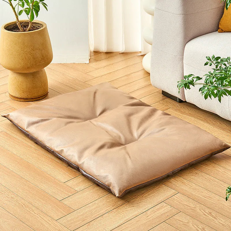 Blue cooling pet bed for cat or small dog showing lightweight foam construction and size scale.