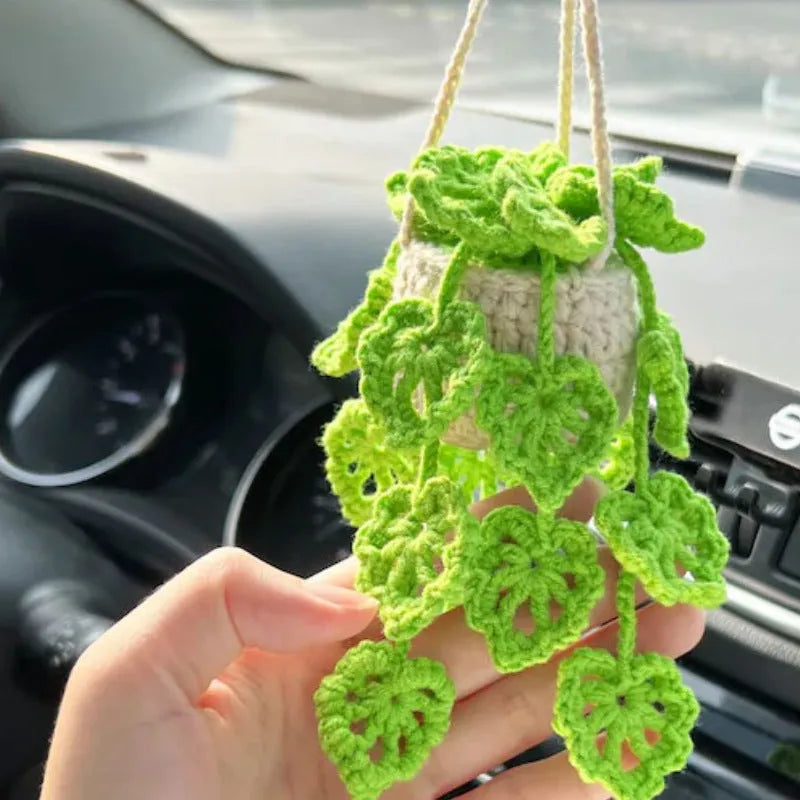 Green and white knitted wool car plant decoration with basin base and hanging rope