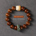 Hand-woven 13mm round bead bracelet with artistic lion designs in ivory nut, sandalwood or yellow gradient bodhi colours