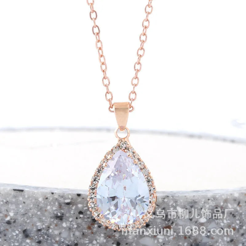 Women's rose gold geometric drop necklace with rhinestone inlay in pink colour
