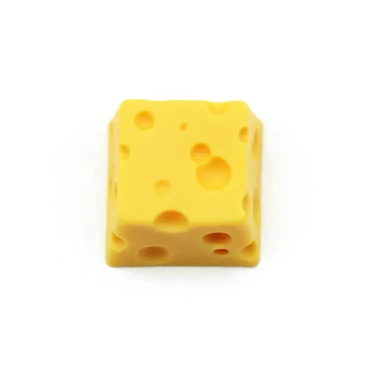 Yellow solid resin artisan key cap sculpted like a piece of cheese for mechanical keyboards.