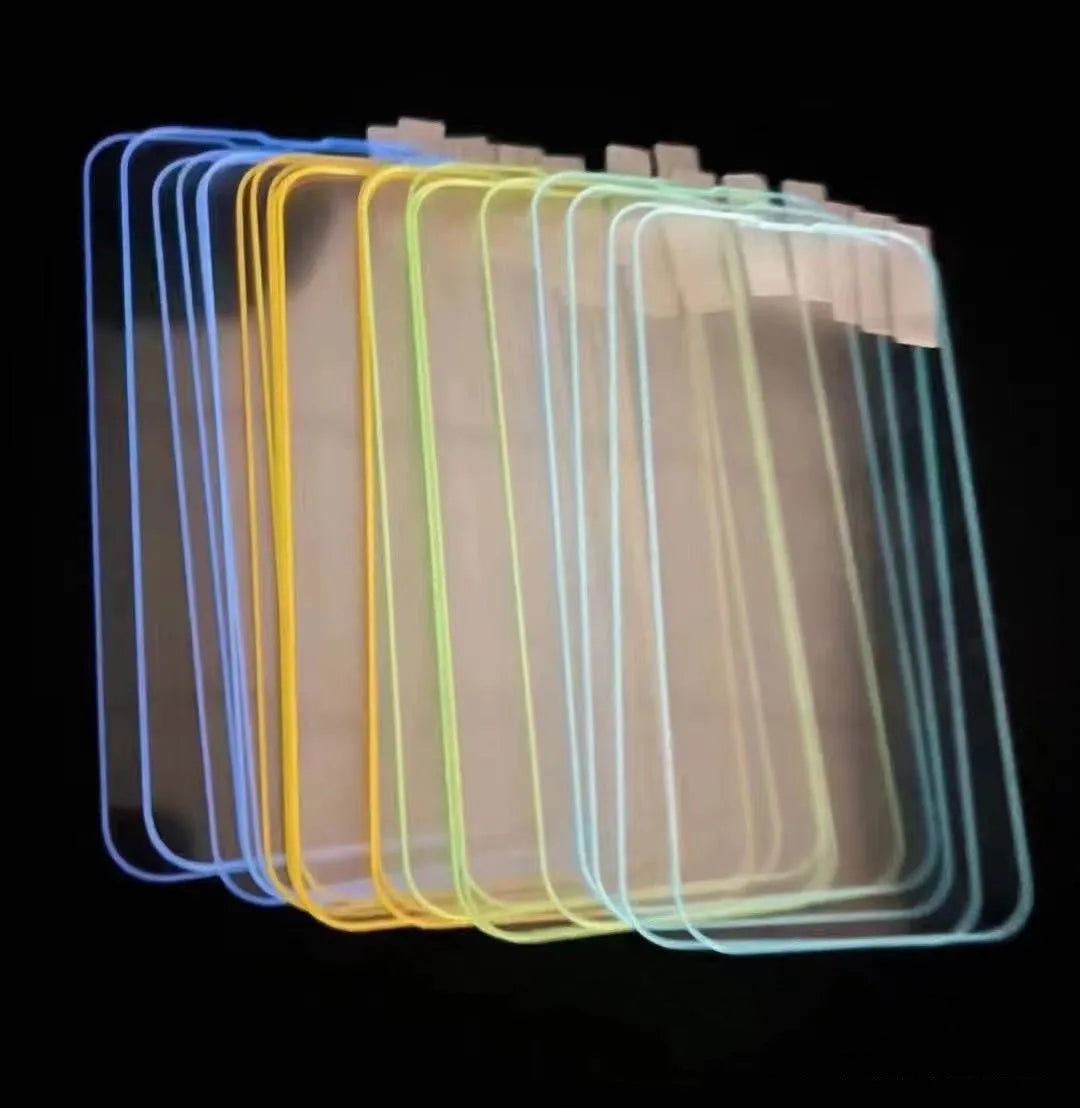 Fluorescent tempered glass screen protector for iPhone with glowing green edge on a phone