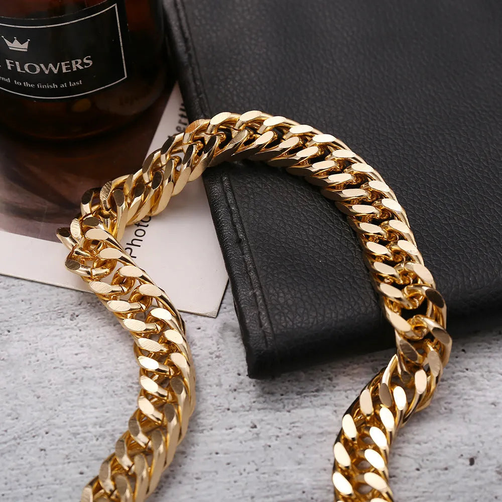 Gold-toned women's thick chain necklace with an integrated rectangular pendant, shown on a plain background.