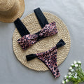 Women's leopard print bikini with tube top and split bottoms in black or leopard pattern
