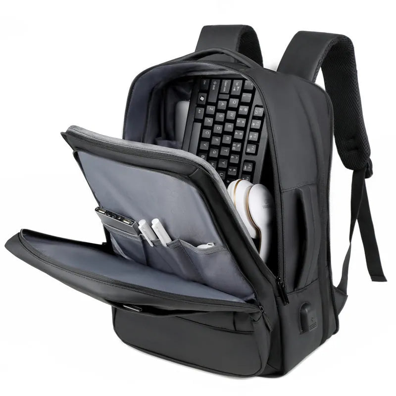 Men's black waterproof backpack with curved shoulder straps and 20-35L capacity for business travel