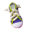 Grey and white dog toy slipper with black laces, blue sole, and a bell on the side