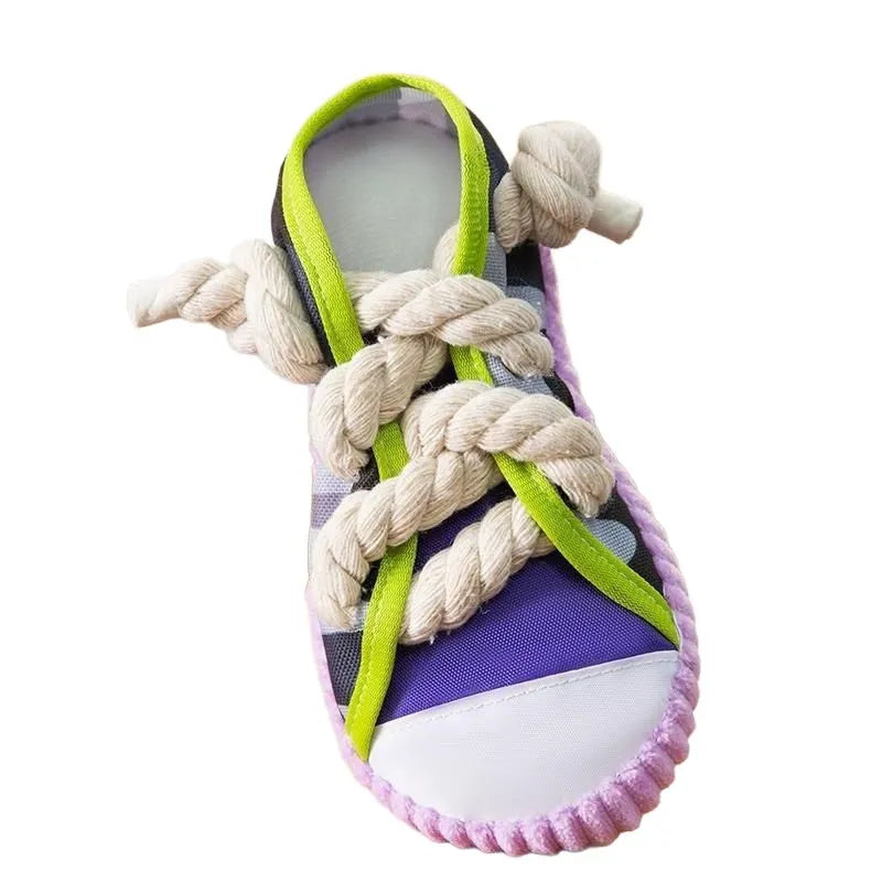 Grey and white dog toy slipper with black laces, blue sole, and a bell on the side