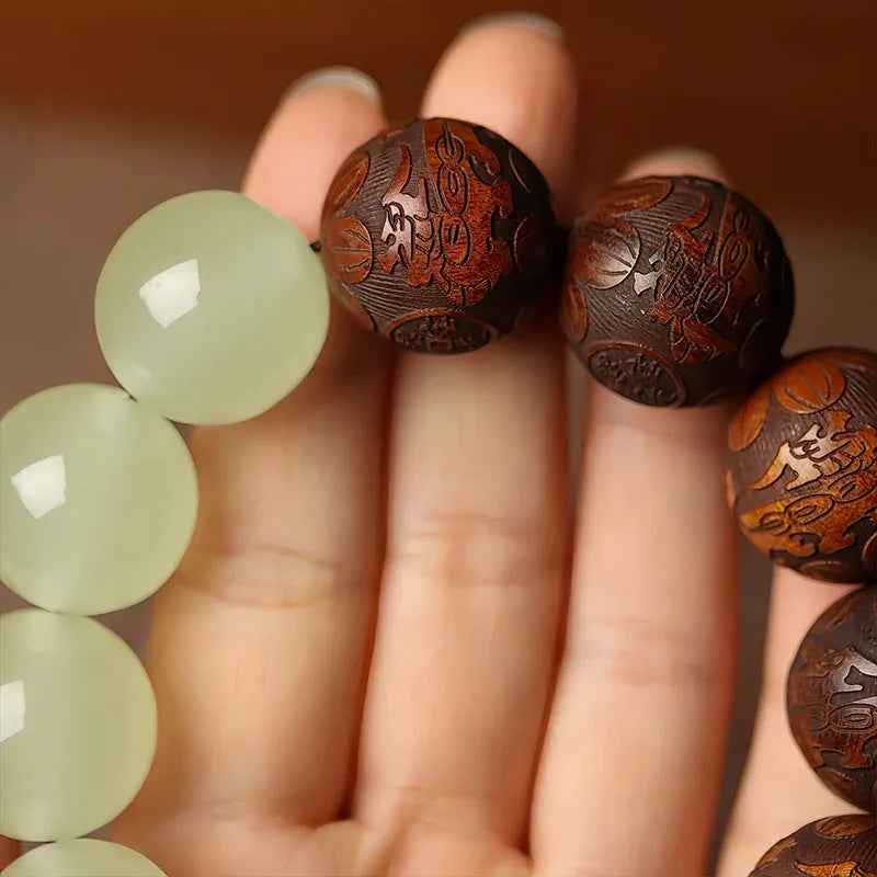 Rosewood flexible bracelet with fu character carving showing 20mm rings and amass fortunes colour finish