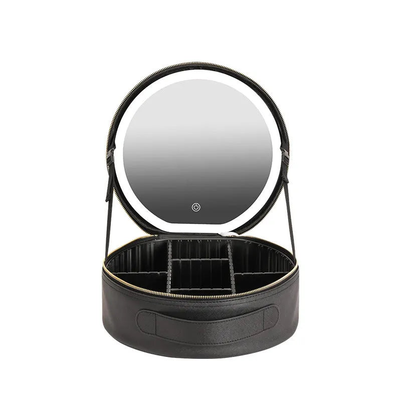Round pink PU leather makeup bag open showing illuminated mirror and internal partitions.